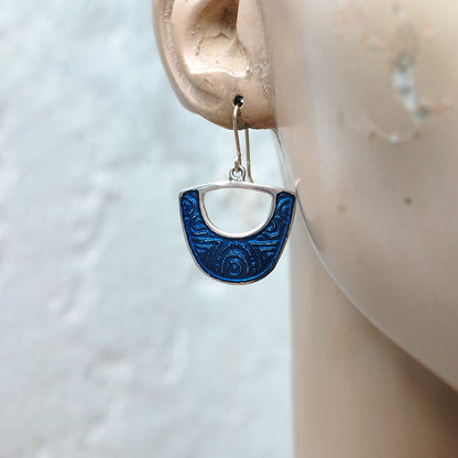 Midnight blue enamel on silver earrings, shield cutout shape, on a  mannequin
